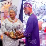 (R) Lion Chike Akaeze, Immediate Past Club President, handing over Gong and Gavel (symbol of authority) to Lion Johnson Adetola, (L) the new club president of Ikeja Metro Lions Club.