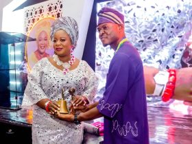 (R) Lion Chike Akaeze, Immediate Past Club President, handing over Gong and Gavel (symbol of authority) to Lion Johnson Adetola, (L) the new club president of Ikeja Metro Lions Club.