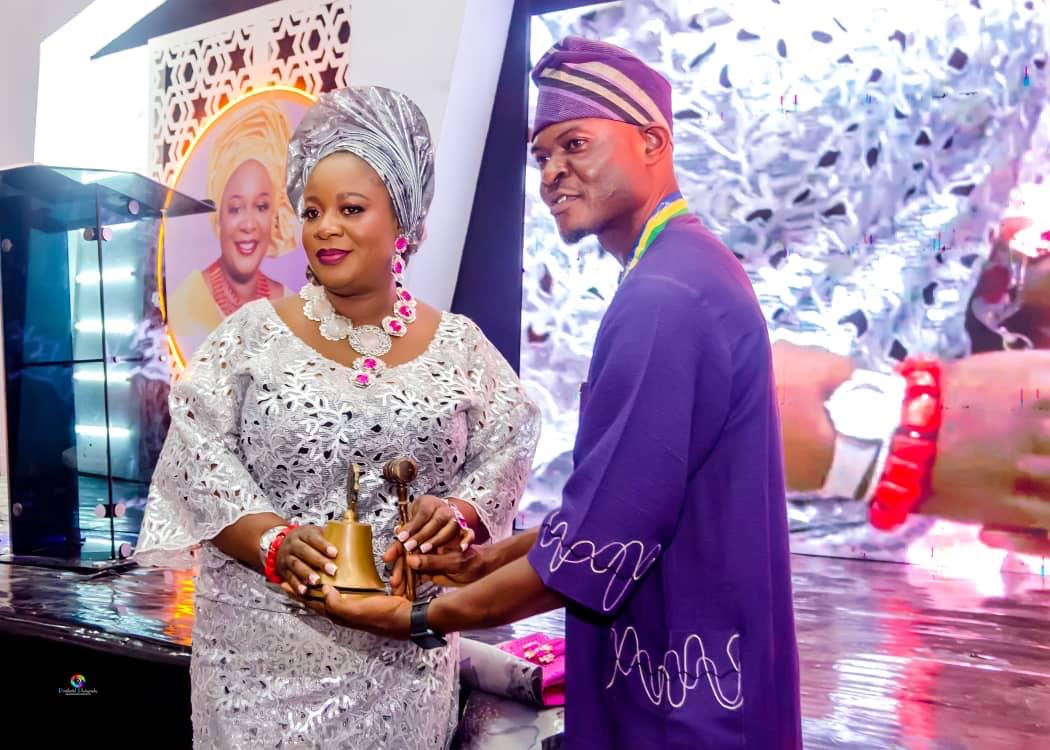 (R) Lion Chike Akaeze, Immediate Past Club President, handing over Gong and Gavel (symbol of authority) to Lion Johnson Adetola, (L) the new club president of Ikeja Metro Lions Club.